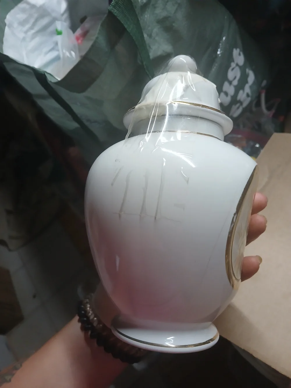 vintage Japanese white porcelain ginger jar featuring a metallic inlaid medallio